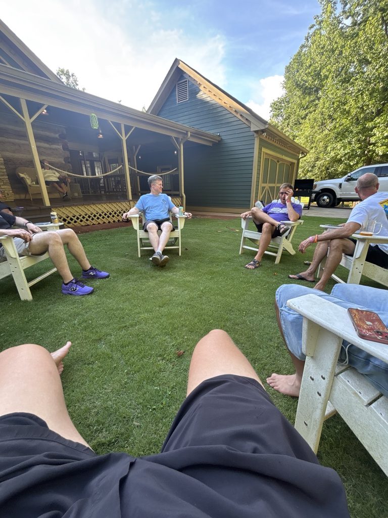 B2 Motorsports team in Adirondack chairs on Saturday evening