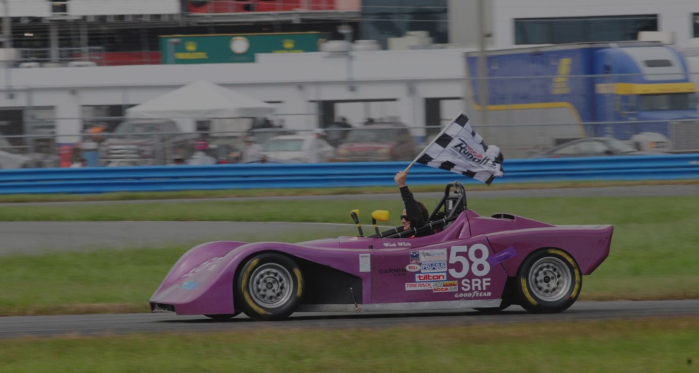 B2 Motorsports Spec Racer Ford number 58 taking the checkered flag